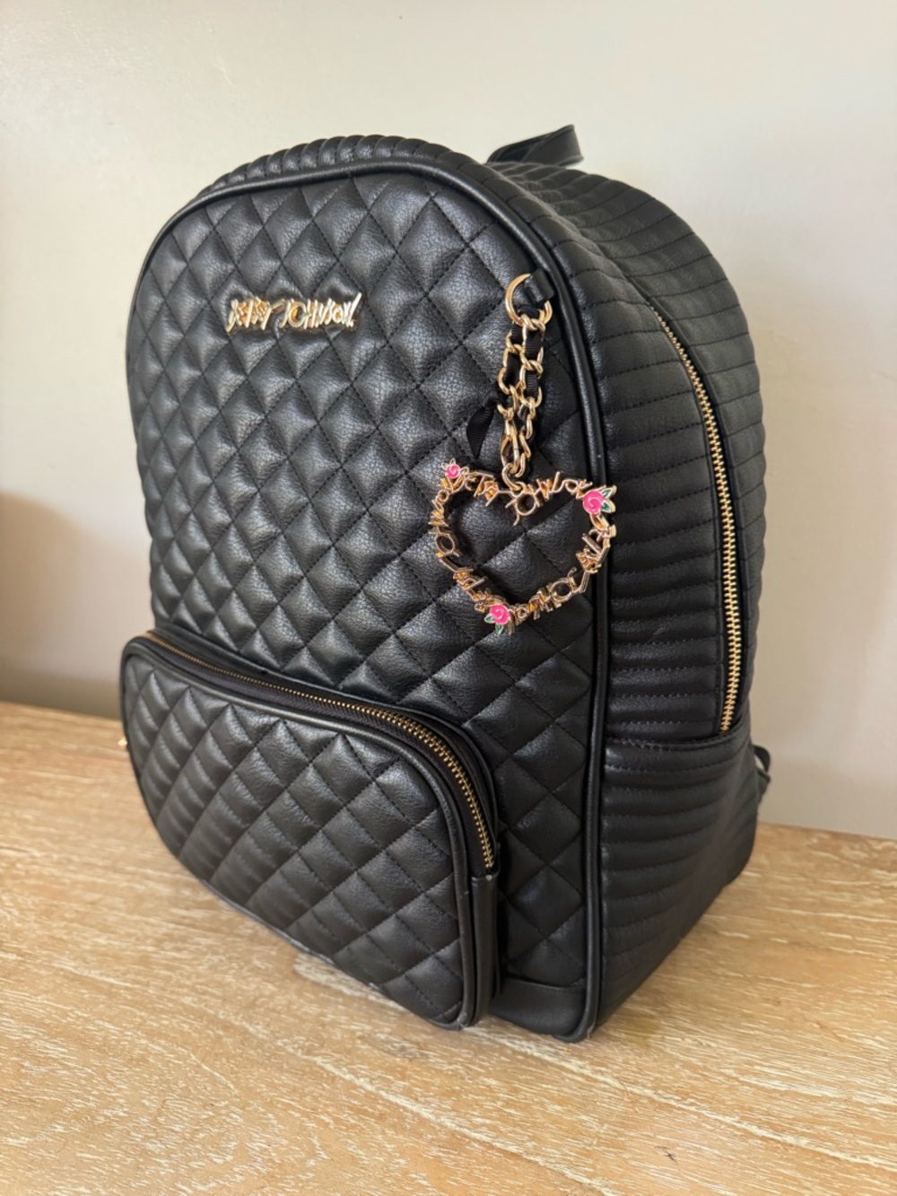 Black Quilted Women’s Backpack with Gold Heart Charm